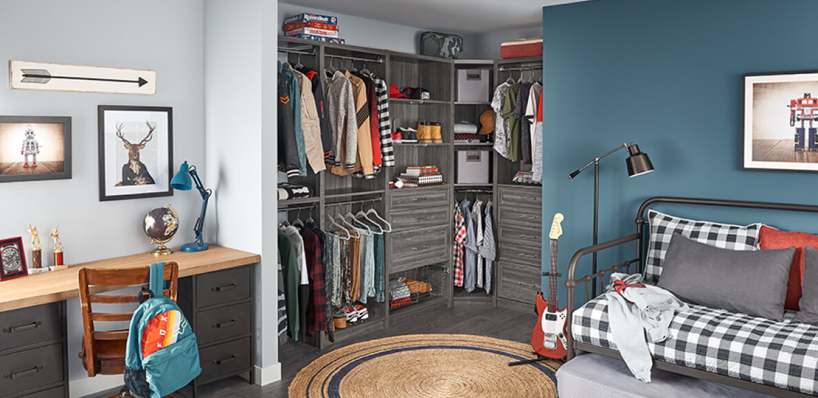 A SpaceCreations closet in Cool Gray gives a teen bedroom a grown-up feel.